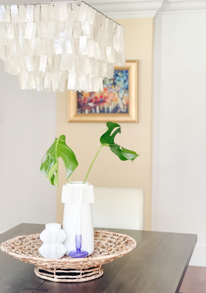 Dining room with modern chandelier and centerpiece