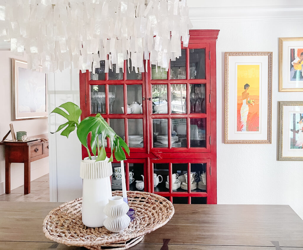 Dining room with modern chandelier and centerpiece