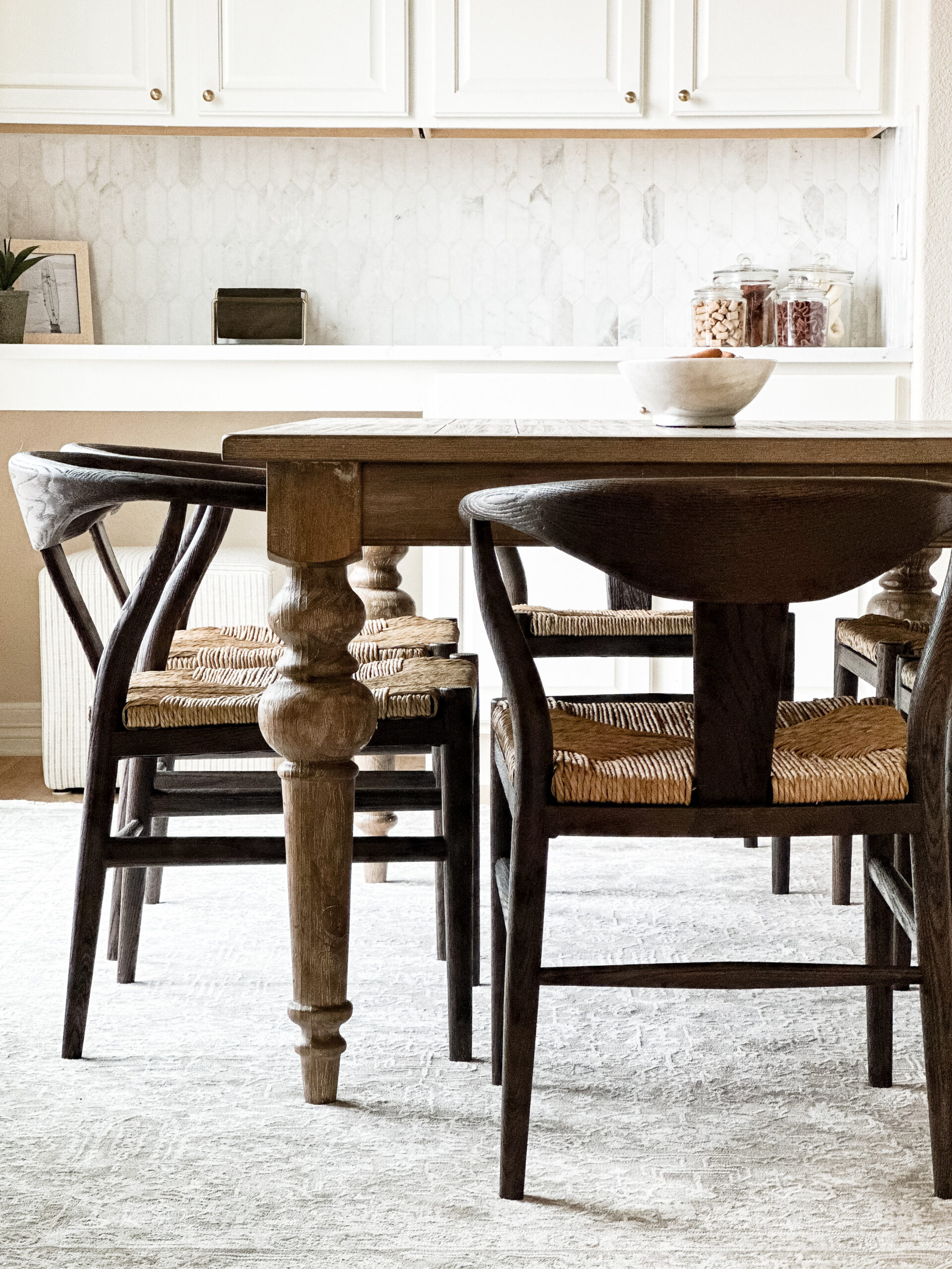 Transitional table with dark chairs and medium tone table.