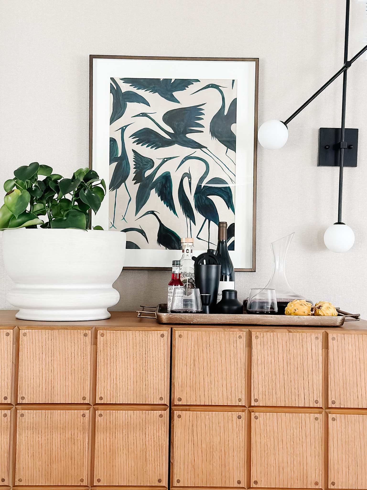 Picture of natural textured wallpaper behind a bar cabinet.