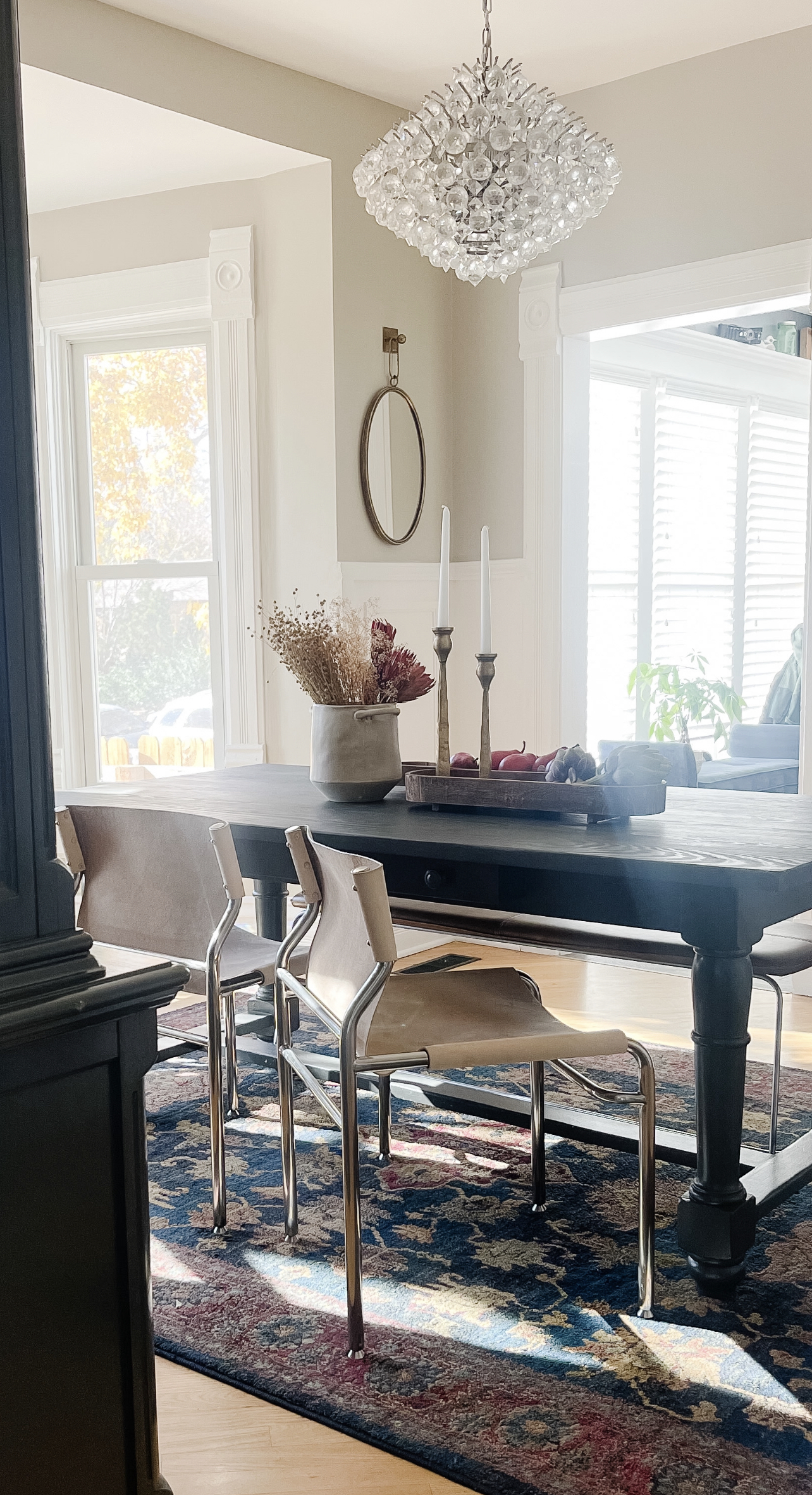 View of dining room from the kitchen of formal dining table with modern dining chairs.