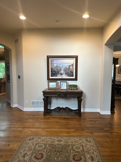 Entryway with a console table and framed artwork