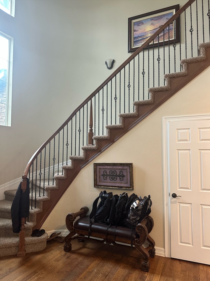 Entryway with a console table and framed artwork